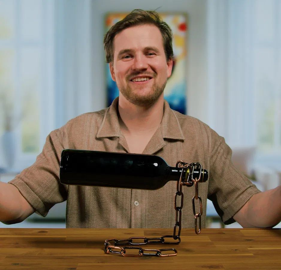 Iron chain wine bottle holder holding up a wine bottle